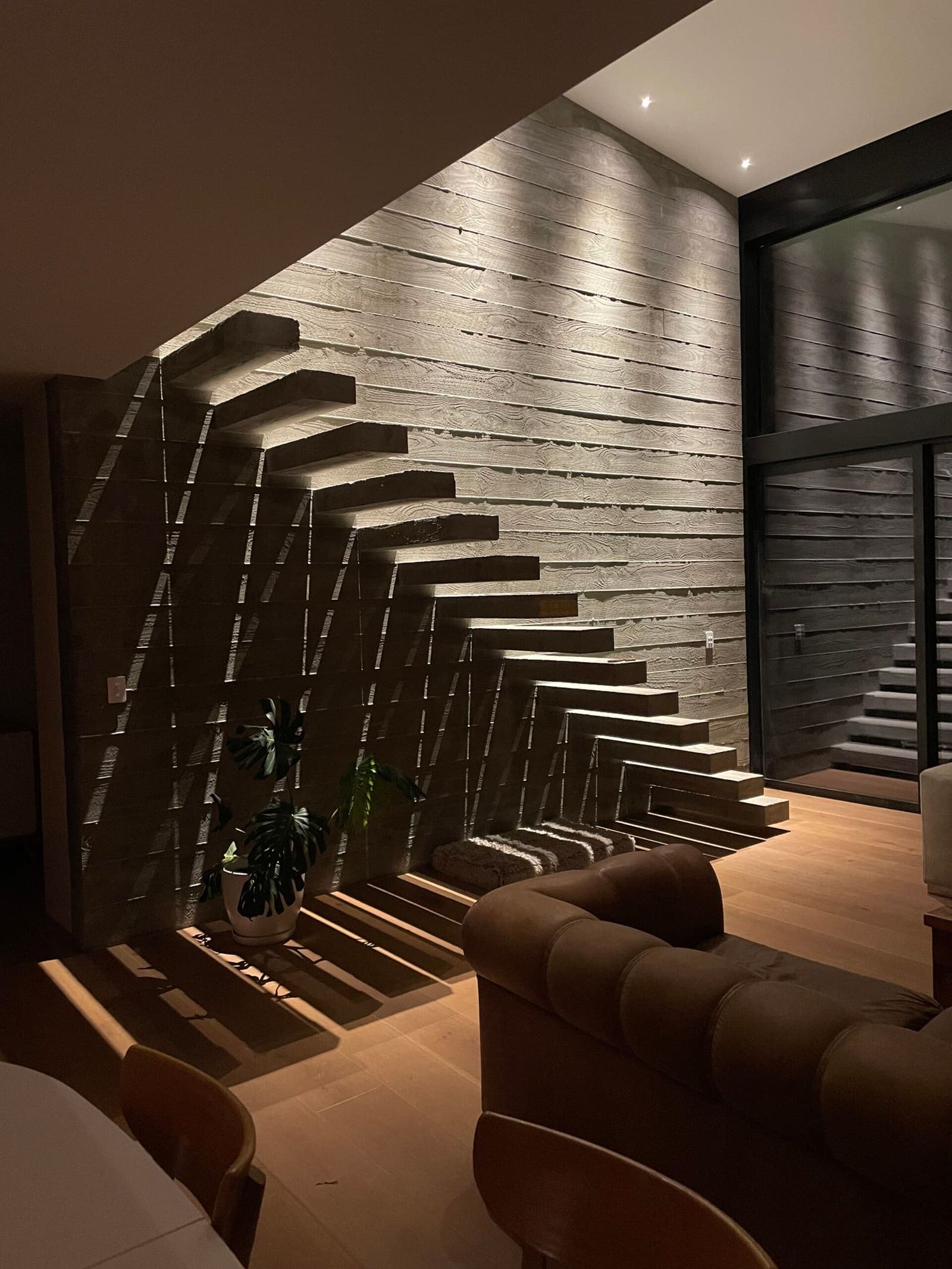 Floating treads in a dark stairwell